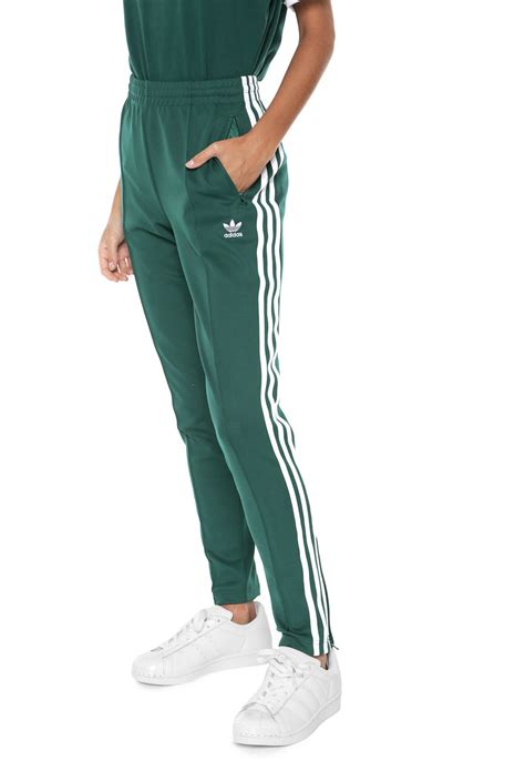 calça adidas originals slim sst tp verde